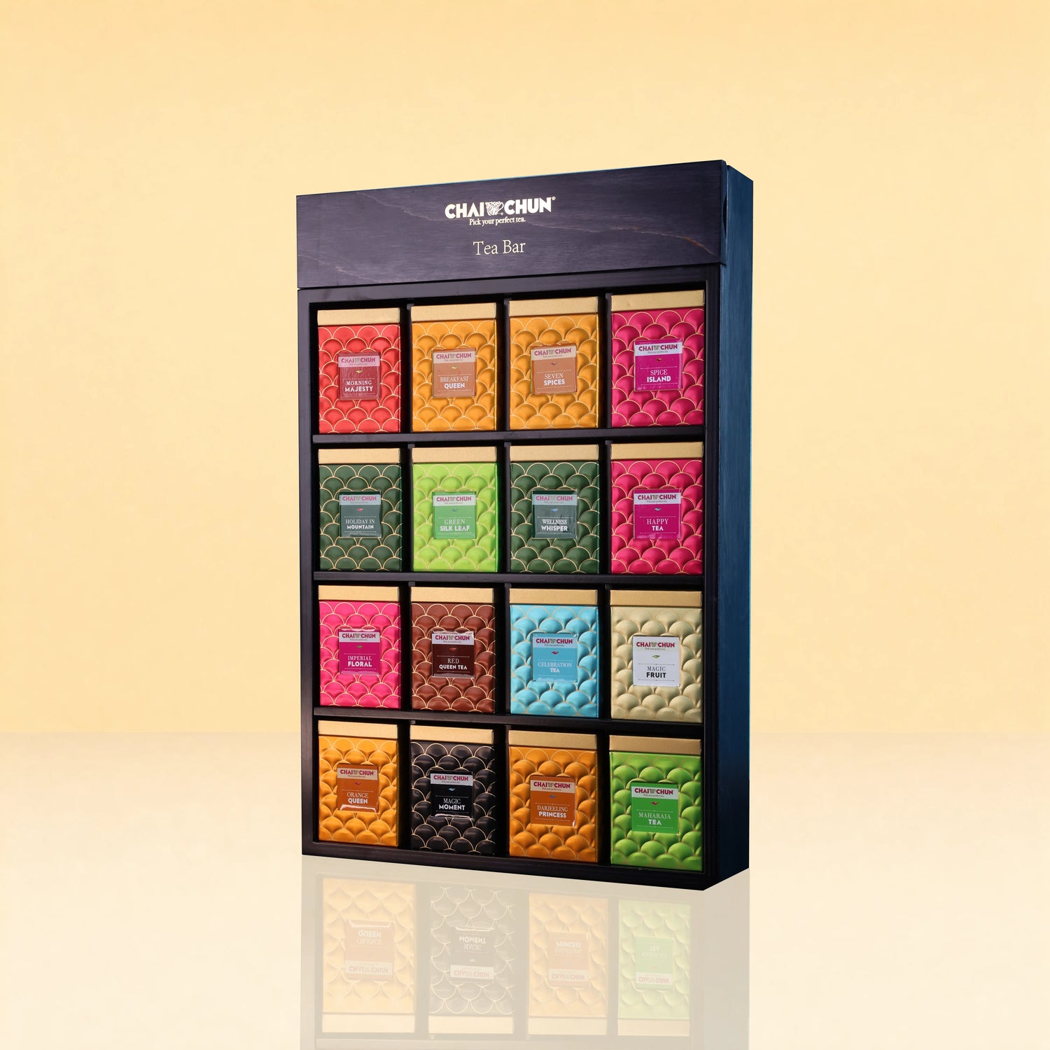 Chaichun Imperial TeaBar - A CHAICHUN Tea Bar display box containing 15 individually wrapped tea bars in a colorful grid, set against a warm beige gradient background.