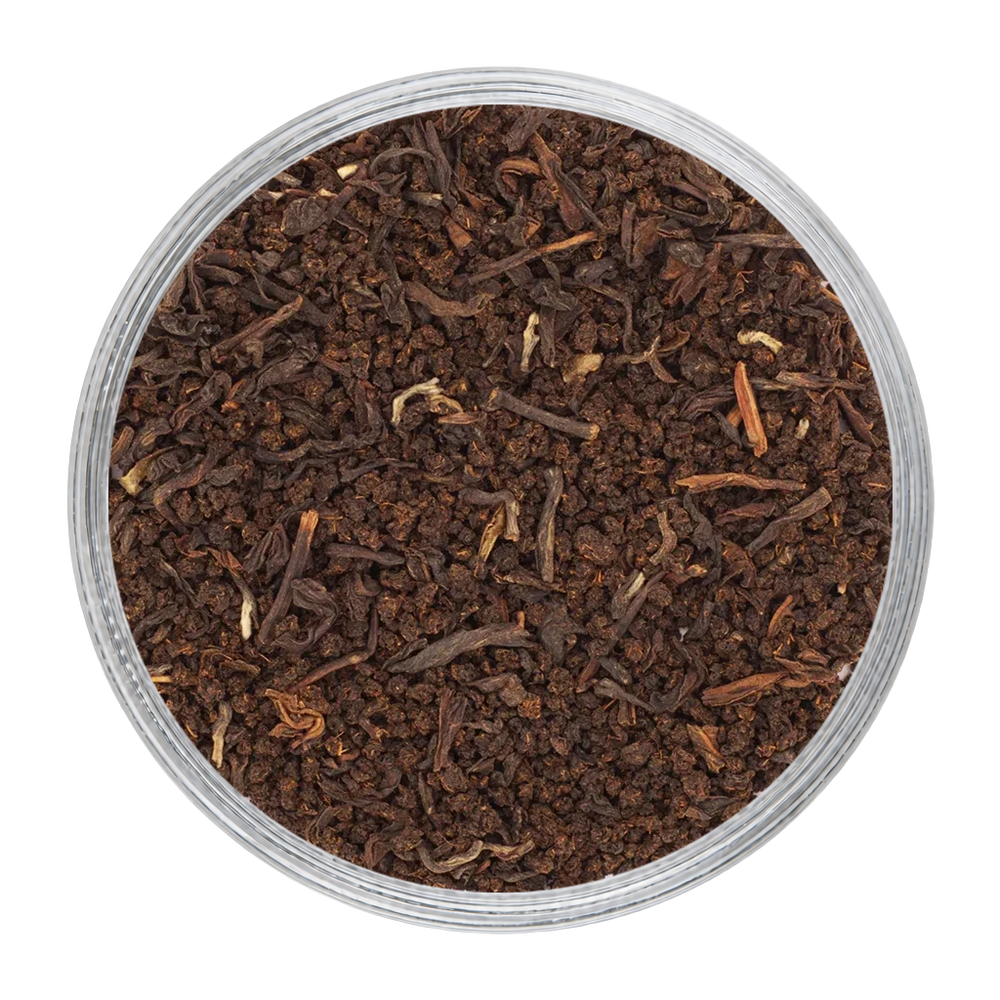 English Breakfast blend showing dark CTC granules alongside fine orthodox tea leaves.
