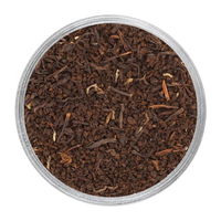English Breakfast blend showing dark CTC granules alongside fine orthodox tea leaves.