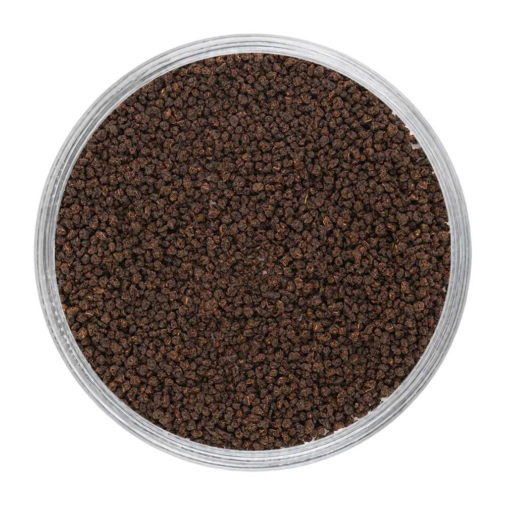 Kadak Shaam dry tea leaves showing rich colour, texture, and granular appearance.