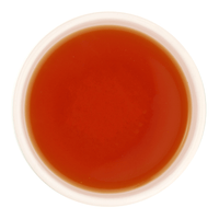 Freshly brewed Nimbu Spice tea showing a bright, clear golden amber liquor beautifully.