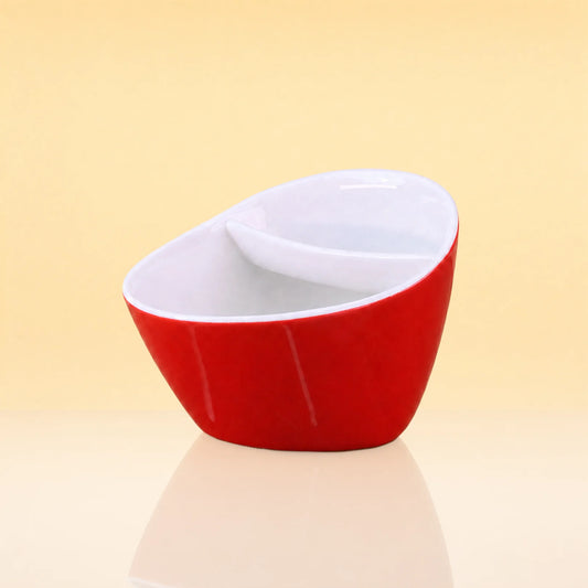 WaveMinimalistCeramicCupwithTeaStrainer - A modern, asymmetrical ceramic bowl with a glossy red exterior and a white interior, featuring a small white spoon resting inside. The bowl is set against a warm, solid pale yellow background with a soft reflection on the surface below.