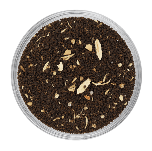 Premium Cardamom Tea dry leaves with fragrant cardamom pieces and rich tea leaves.