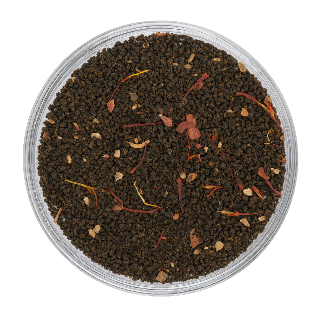 Close-up appearance of Saffron Chai showing dark tea leaves, saffron threads, and warming spices.
