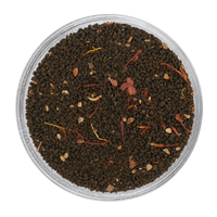 Close-up appearance of Saffron Chai showing dark tea leaves, saffron threads, and warming spices.