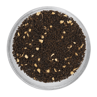 Close-up of ground black pepper in a transparent container on a white background