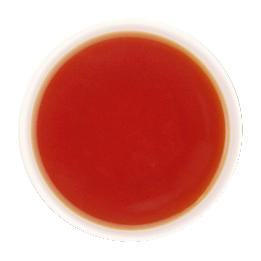A freshly brewed cup of Clove Protect Tea without milk, displaying a clear, bright reddish-brown to amber tea liquor with a smooth and inviting appearance.